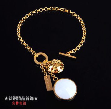Bvlgari Charm Bracelet in 18kt Yellow Gold with White Mother of